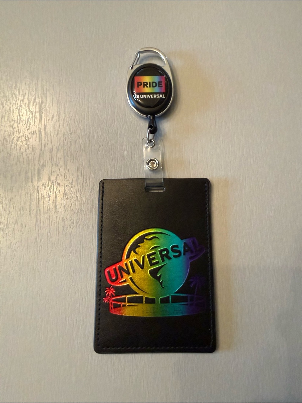 Universal Black Badge Holder with Rainbow Holographic Logo and Pride Reel
